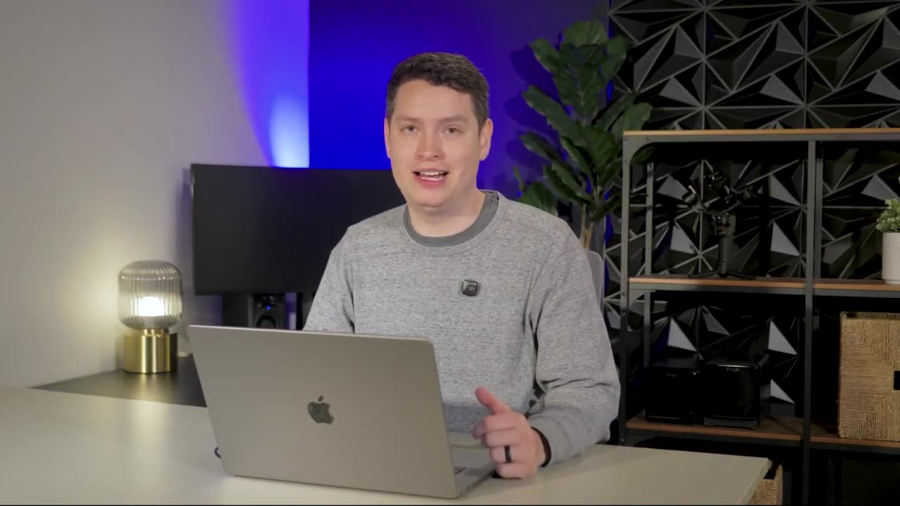 Justin Herrera at his desk, talking about editing over 300 weddings