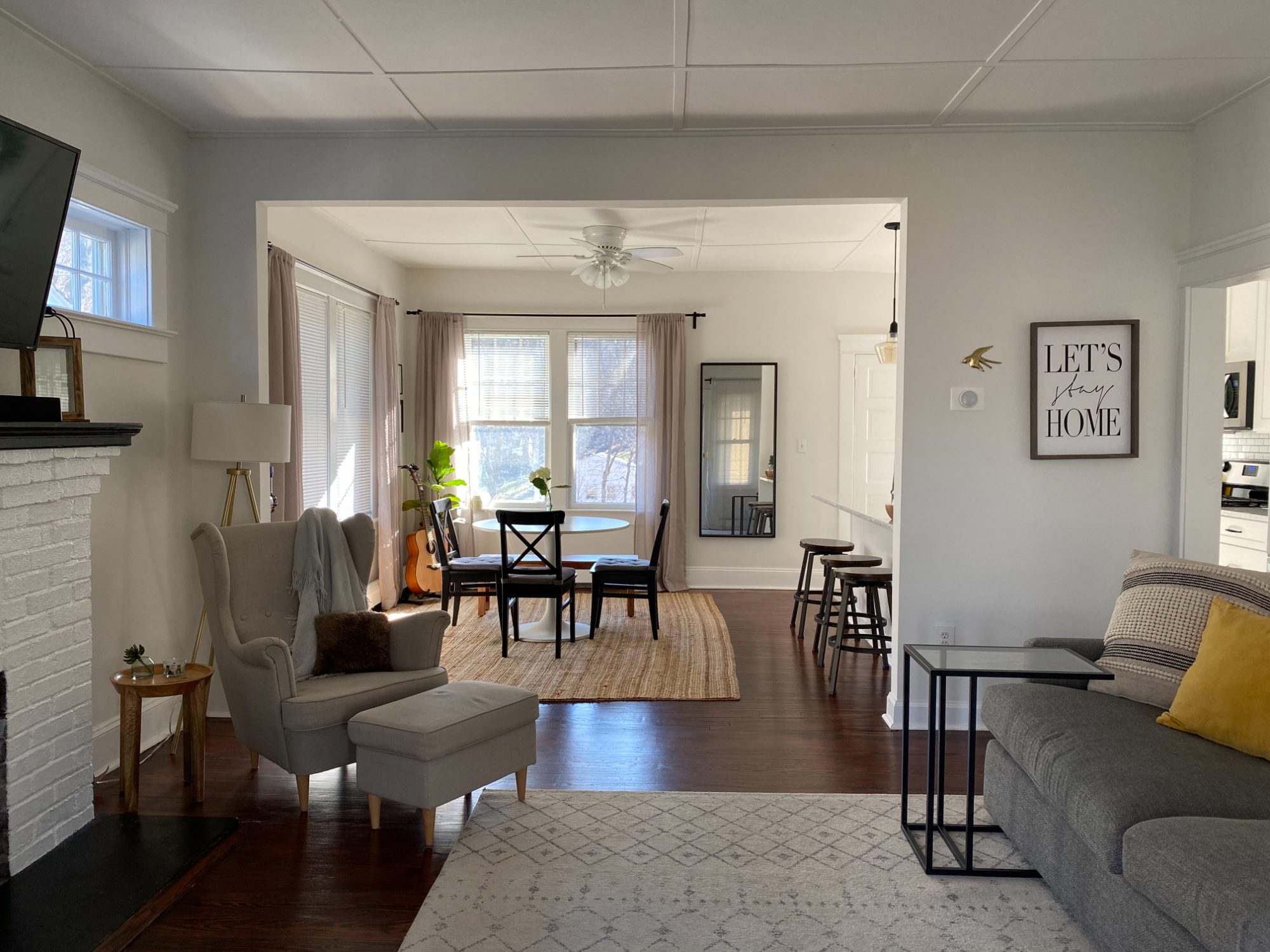 The living and dining rooms after renovation, with the French doors gone and the opening widened.
